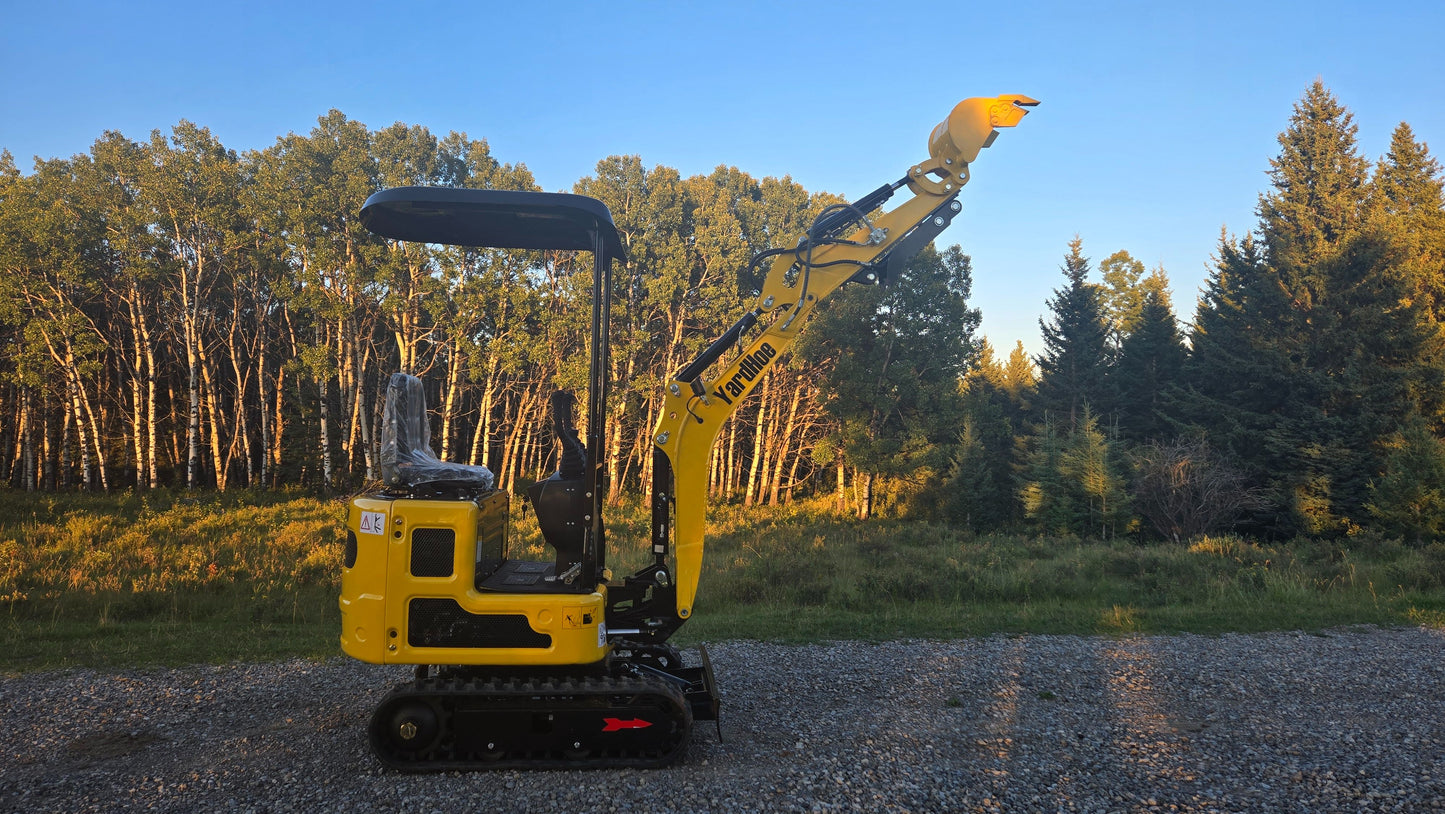 Side view of YardHoe YH12 / Rippa R319 mini excavator with raised boom and bucket, compact digger for landscaping and construction work.
