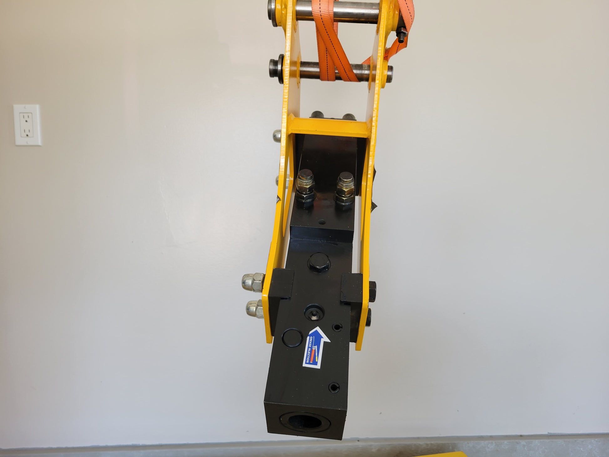 Hydraulic breaker hammer for excavators Canada and USA front view showing heavy duty mounting bolts and lower hammer body designed for demolition and construction attachment use.
