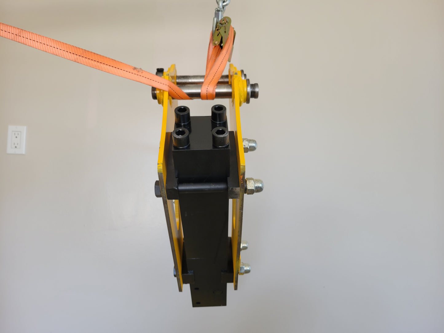 Hydraulic breaker hammer for excavators Canada and USA top mount view showing hydraulic hose connection ports and heavy duty bolts for demolition and construction attachment use.

