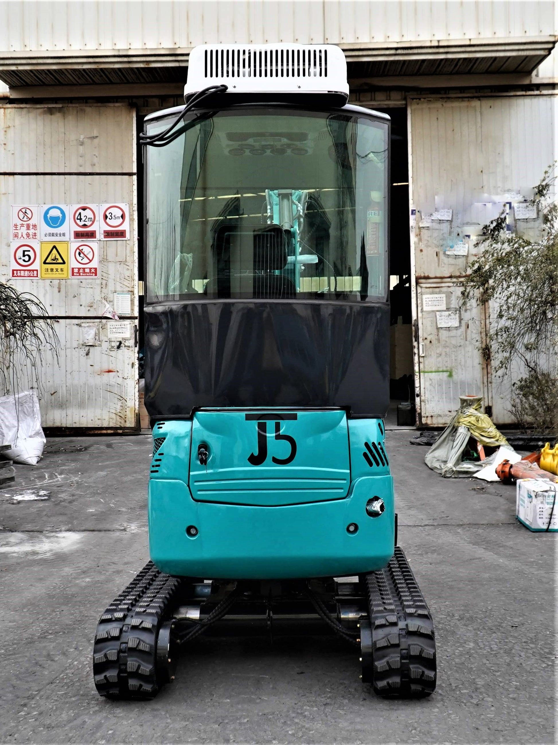 JT5200 Special Edition 2 Ton Mini Excavator rear view showing cab, tracks, and cooling system – compact 4400 lbs digger with Kubota engine for landscaping and construction.