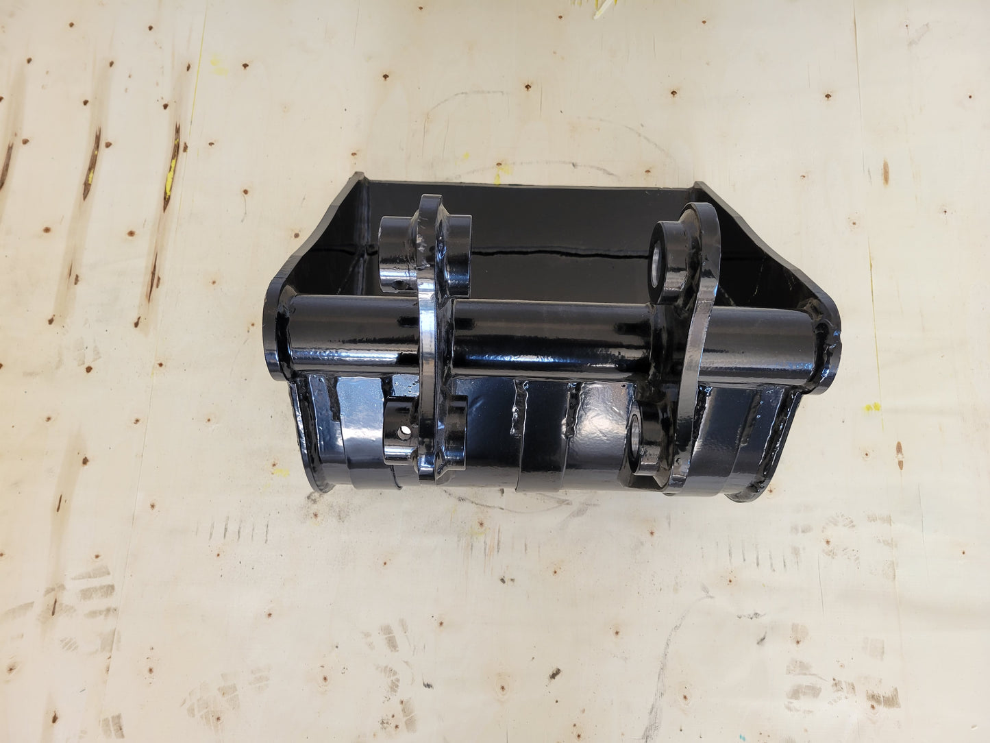 Mini excavator cleanup bucket for Canada showing top down view highlighting mounting bracket and welded structure for landscaping excavation and heavy duty cleanup work.